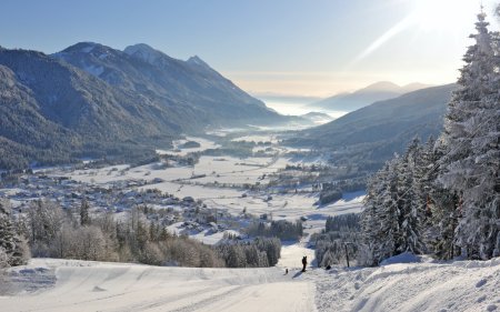 View from slope onto snowy valley