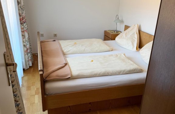 Bedroom with made-up double bed